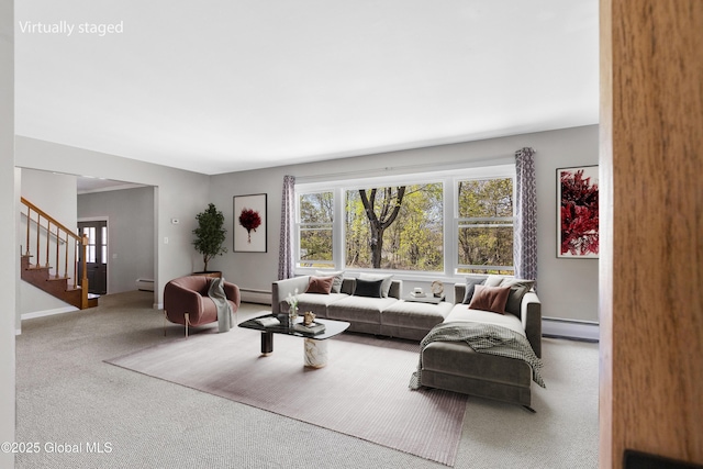 27 Aaron Dr, Catskill, NY 12414 - carpeted living room featuring baseboard heating, plenty of natural light, and stairs