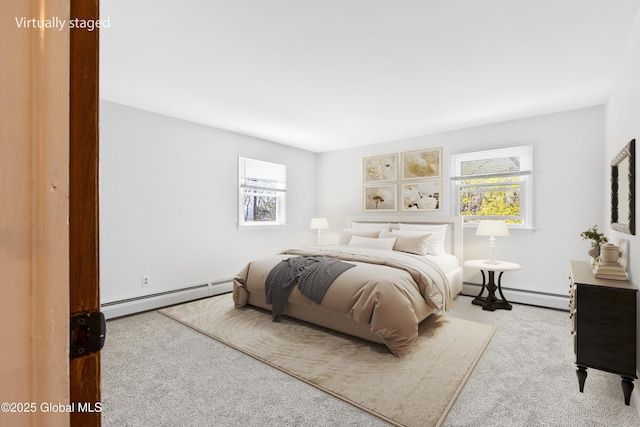 27 Aaron Dr, Catskill, NY 12414 - carpeted bedroom with a baseboard heating unit and multiple windows