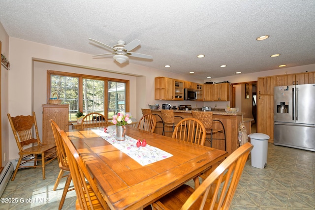 dining room featuring recessed lighting, a textured ceiling, and ceiling fan