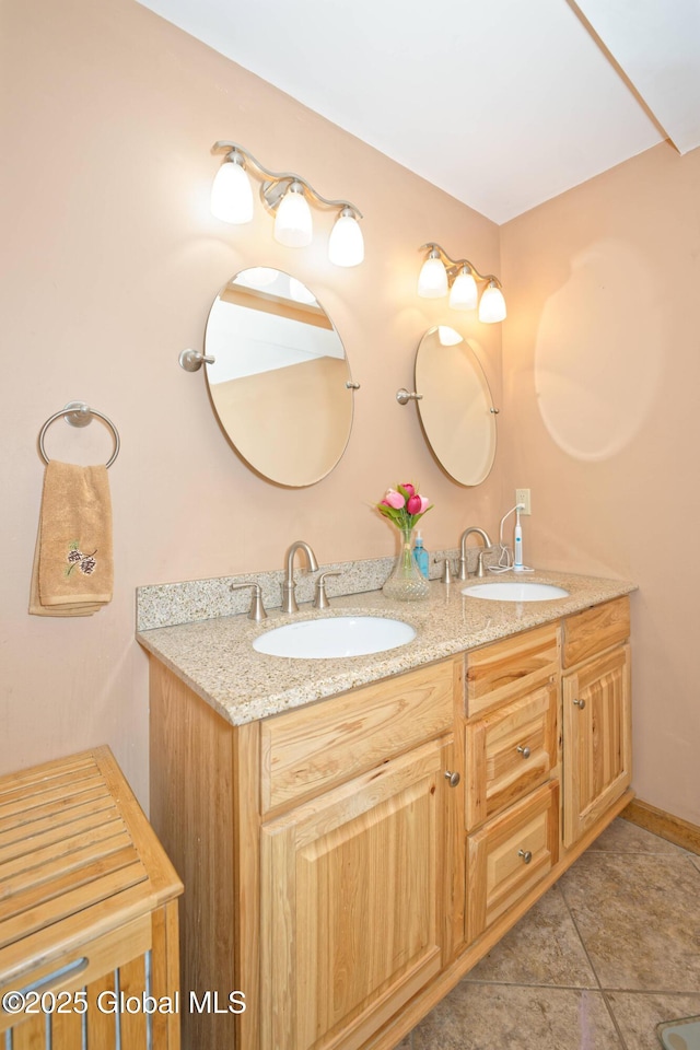 full bathroom featuring double vanity and a sink