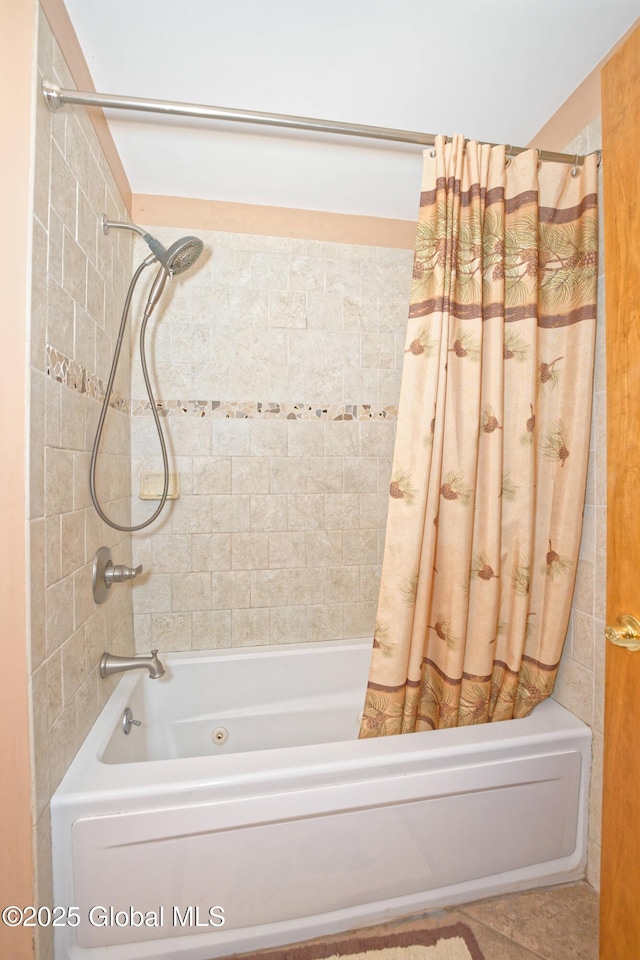 full bath featuring shower / tub combo with curtain and tile patterned floors