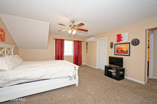 bedroom featuring baseboards, baseboard heating, a textured ceiling, a wall mounted AC, and carpet flooring