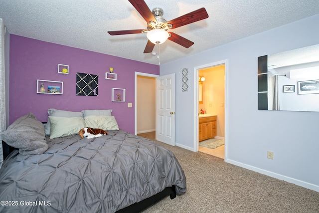 carpeted bedroom with connected bathroom, a ceiling fan, a textured ceiling, and baseboards