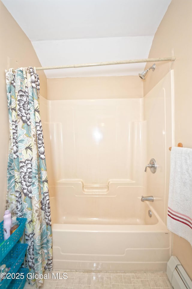 bathroom featuring a baseboard radiator and shower / tub combo