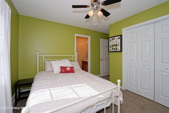 bedroom featuring a closet, a textured ceiling, carpet, and ceiling fan