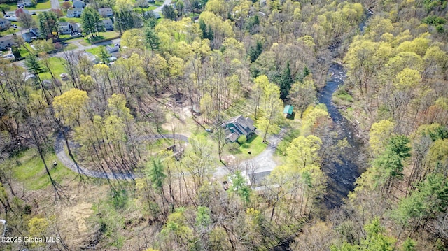 bird's eye view featuring a forest view