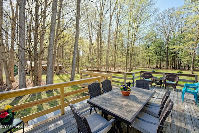 wooden deck featuring outdoor dining space