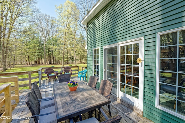 wooden deck with outdoor dining space