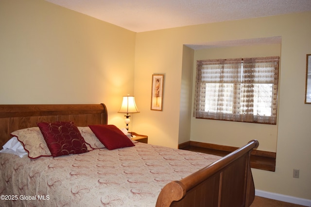 bedroom featuring baseboards