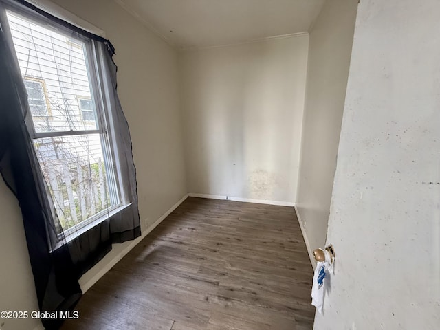 25-27 Caroline St, Amsterdam, NY 12010 - unfurnished room featuring baseboards, ornamental molding, wood finished floors, and a healthy amount of sunlight