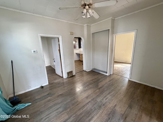 25-27 Caroline St, Amsterdam, NY 12010 - interior space with arched walkways, a ceiling fan, baseboards, wood finished floors, and ornamental molding