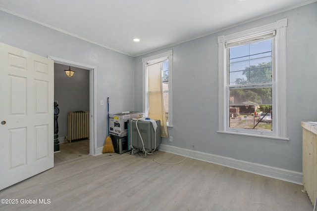502 1st St, Albany, NY 12206 - home office with radiator heating unit, ornamental molding, wood finished floors, baseboards, and recessed lighting