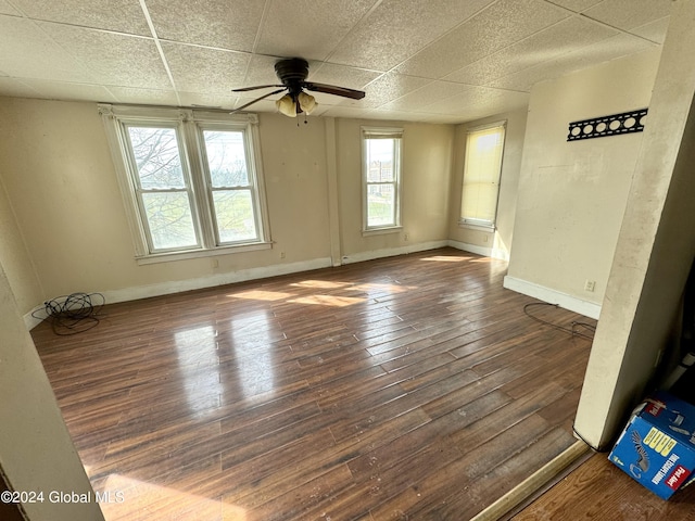 29 Park St, Fonda, NY 12068 - unfurnished room with baseboards, a ceiling fan, a drop ceiling, and hardwood / wood-style floors