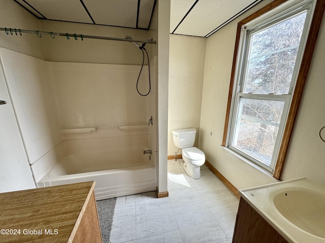 29 Park St, Fonda, NY 12068 - bathroom featuring tile patterned flooring, vanity, shower / bathtub combination, toilet, and baseboards