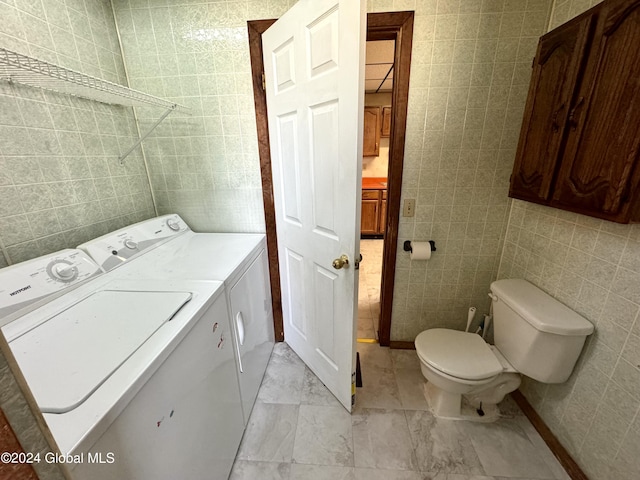 29 Park St, Fonda, NY 12068 - laundry room with tile walls, laundry area, and separate washer and dryer