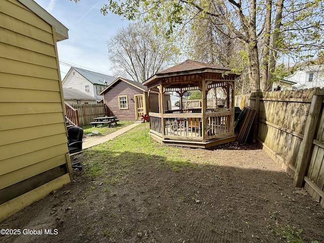 29 Park St, Fonda, NY 12068 - view of yard featuring a fenced backyard, a wooden deck, a gazebo, and an outdoor structure
