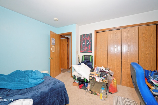 carpeted bedroom with a closet