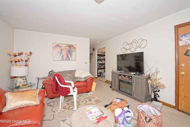 living area with carpet floors and baseboards