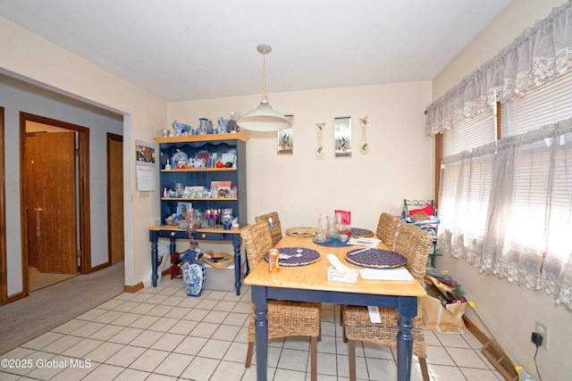 dining room with visible vents, baseboards, and light tile patterned flooring