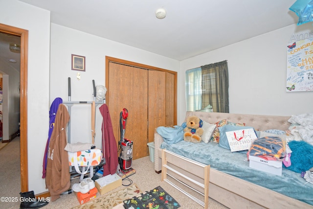 carpeted bedroom featuring a closet