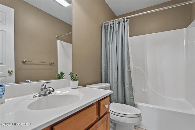 full bathroom with vanity, shower / bath combination with curtain, and toilet