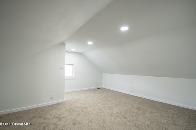 additional living space with baseboards, carpet flooring, recessed lighting, and lofted ceiling