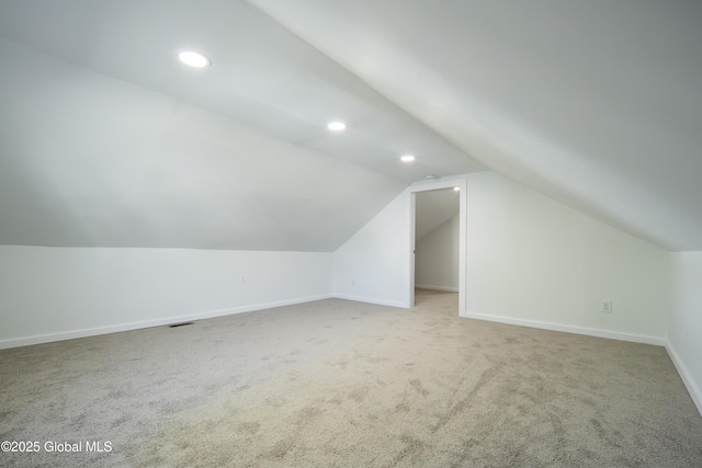 bonus room featuring recessed lighting, baseboards, carpet, and lofted ceiling
