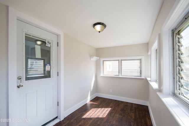 unfurnished sunroom featuring a wealth of natural light
