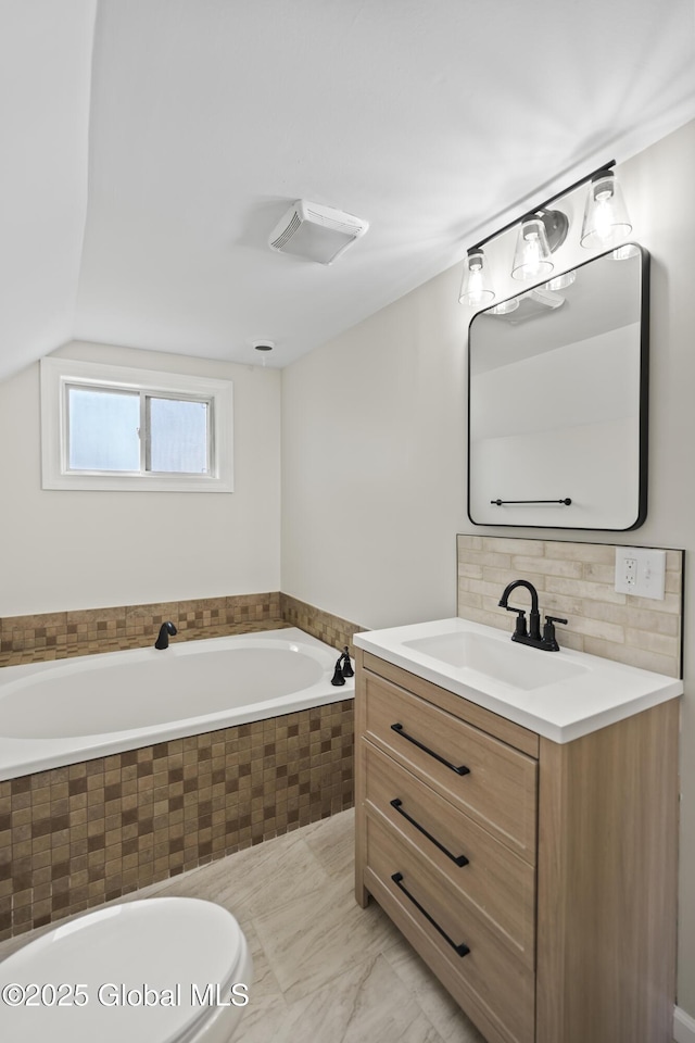full bathroom featuring a garden tub, backsplash, visible vents, and vanity