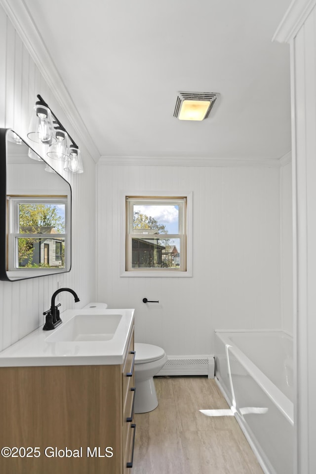 full bath featuring vanity, visible vents, a healthy amount of sunlight, and a baseboard radiator
