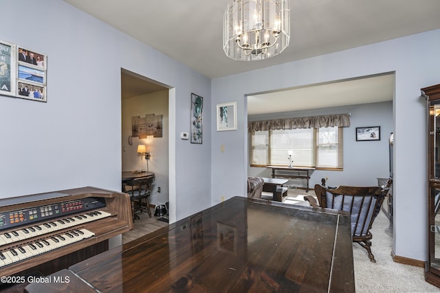 hall featuring an inviting chandelier