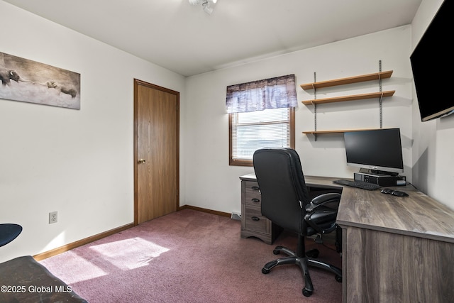 carpeted office space with baseboards
