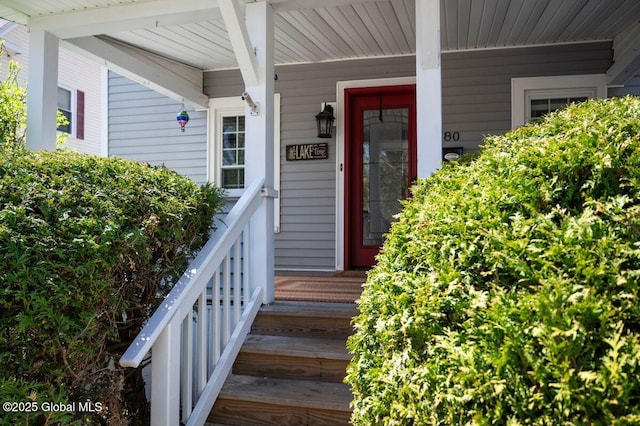 doorway to property featuring a porch
