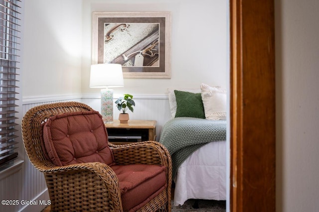 living area with a wainscoted wall