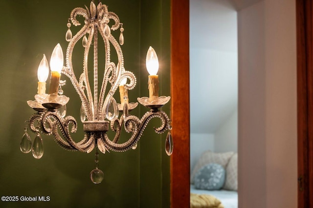 interior details featuring a notable chandelier