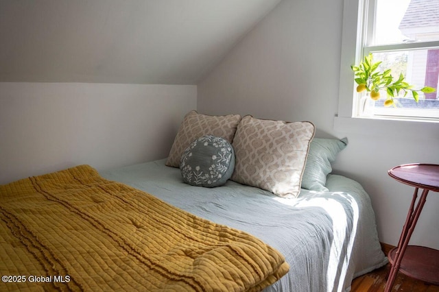 bedroom with lofted ceiling
