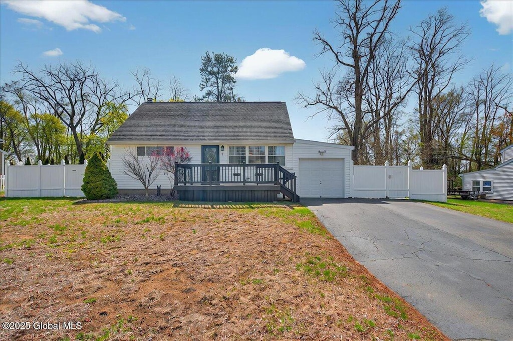 11 Red Fox Dr, Colonie, NY 12205 - cape cod-style house featuring a wooden deck, a gate, a garage, fence, and aphalt driveway