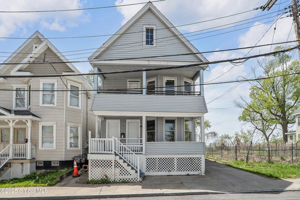 5 Barney St, Schenectady, NY 12307 - view of front facade featuring fence and a balcony