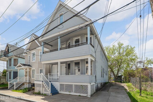 5 Barney St, Schenectady, NY 12307 - view of front of house featuring fence, a porch, and a balcony