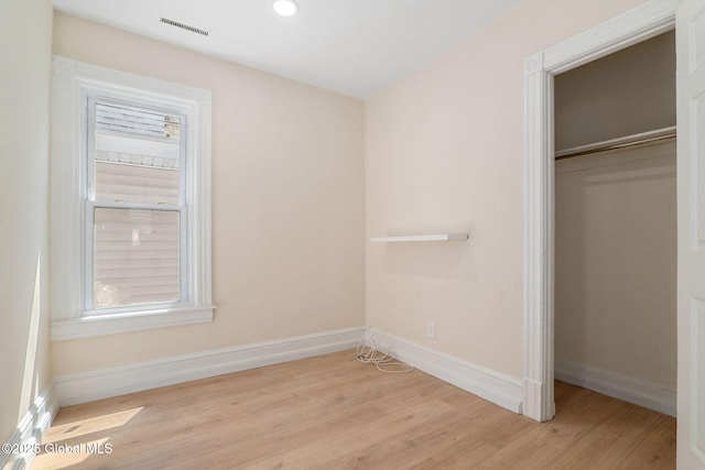 5 Barney St, Schenectady, NY 12307 - unfurnished bedroom featuring baseboards, wood finished floors, visible vents, and a closet
