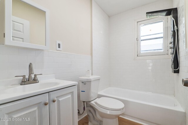 5 Barney St, Schenectady, NY 12307 - bathroom featuring toilet, tile walls, tub / shower combination, and vanity