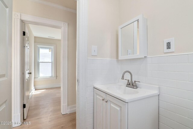 5 Barney St, Schenectady, NY 12307 - bathroom with a wainscoted wall, tile walls, wood finished floors, and vanity