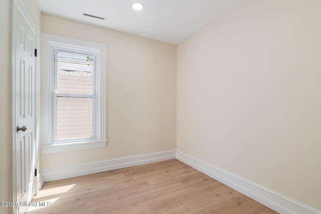 5 Barney St, Schenectady, NY 12307 - spare room with baseboards, plenty of natural light, light wood-style flooring, and visible vents