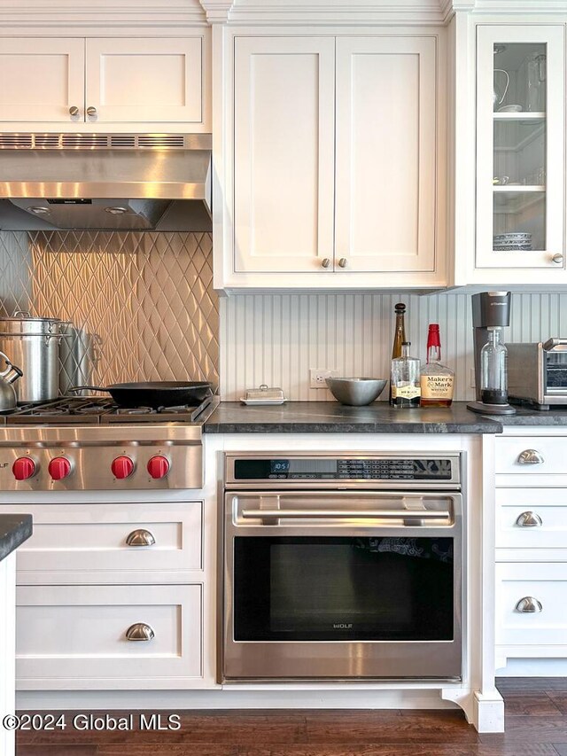 5A6 Sagamore Rd, Bolton, NY 12814 - kitchen featuring dark countertops, stainless steel appliances, tasteful backsplash, and under cabinet range hood