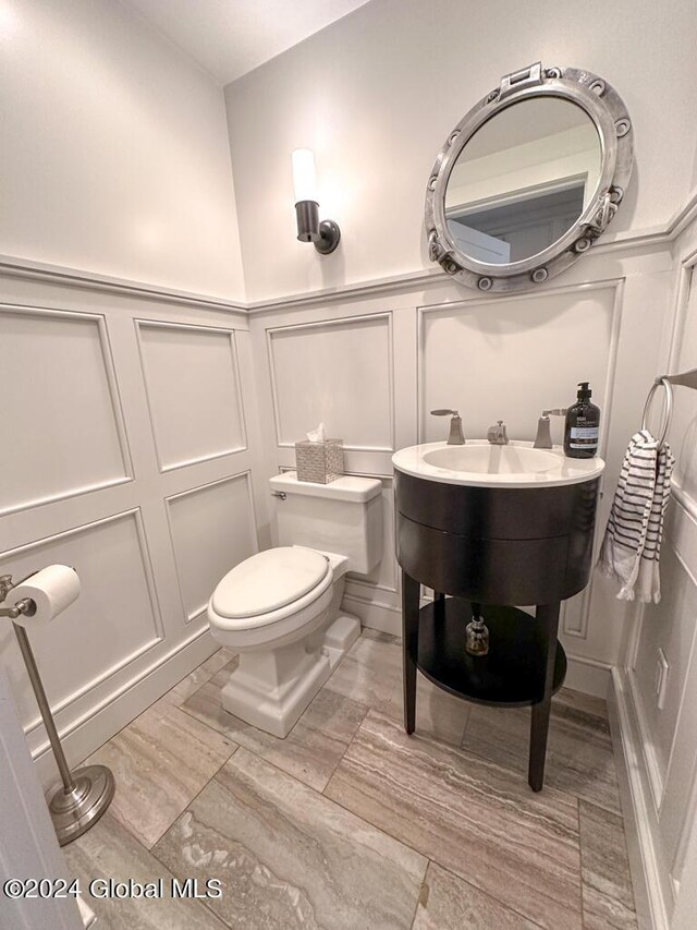 5A6 Sagamore Rd, Bolton, NY 12814 - bathroom with a decorative wall, toilet, and a wainscoted wall