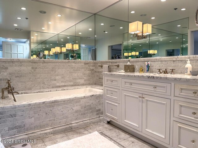 5A6 Sagamore Rd, Bolton, NY 12814 - bathroom with a garden tub, decorative backsplash, visible vents, vanity, and recessed lighting