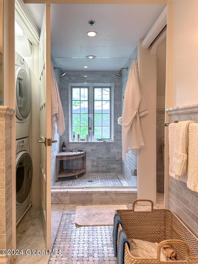 5A6 Sagamore Rd, Bolton, NY 12814 - bathroom featuring tiled shower and stacked washer / dryer