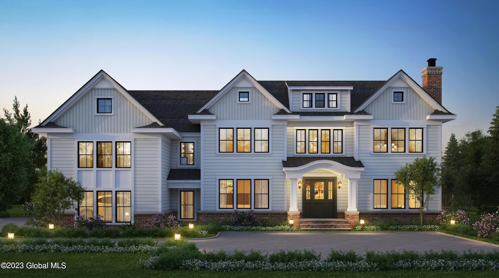 7 Brad Ct, Saratoga Springs, NY 12866 - view of front of property featuring a chimney, brick siding, and board and batten siding