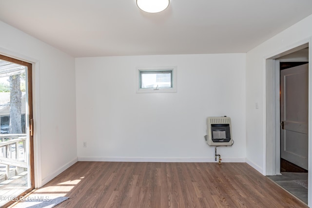 1538 Nott St, Schenectady, NY 12308 - empty room with heating unit, wood finished floors, healthy amount of natural light, and baseboards