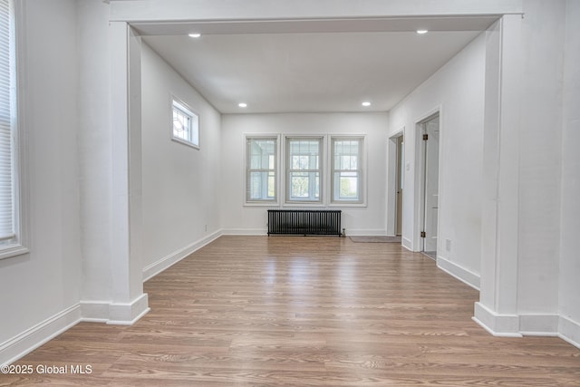 1538 Nott St, Schenectady, NY 12308 - unfurnished room with radiator heating unit, light wood-type flooring, recessed lighting, and baseboards